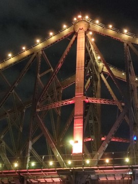 Lights on a large metal bridge