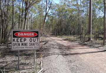 A keep out sign in a forest