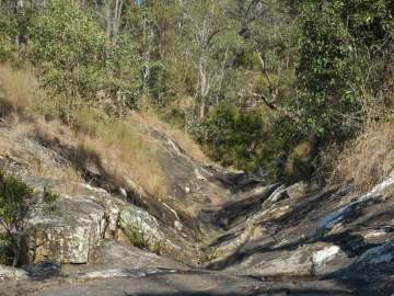 Sun and shadow fall across weathered rocks